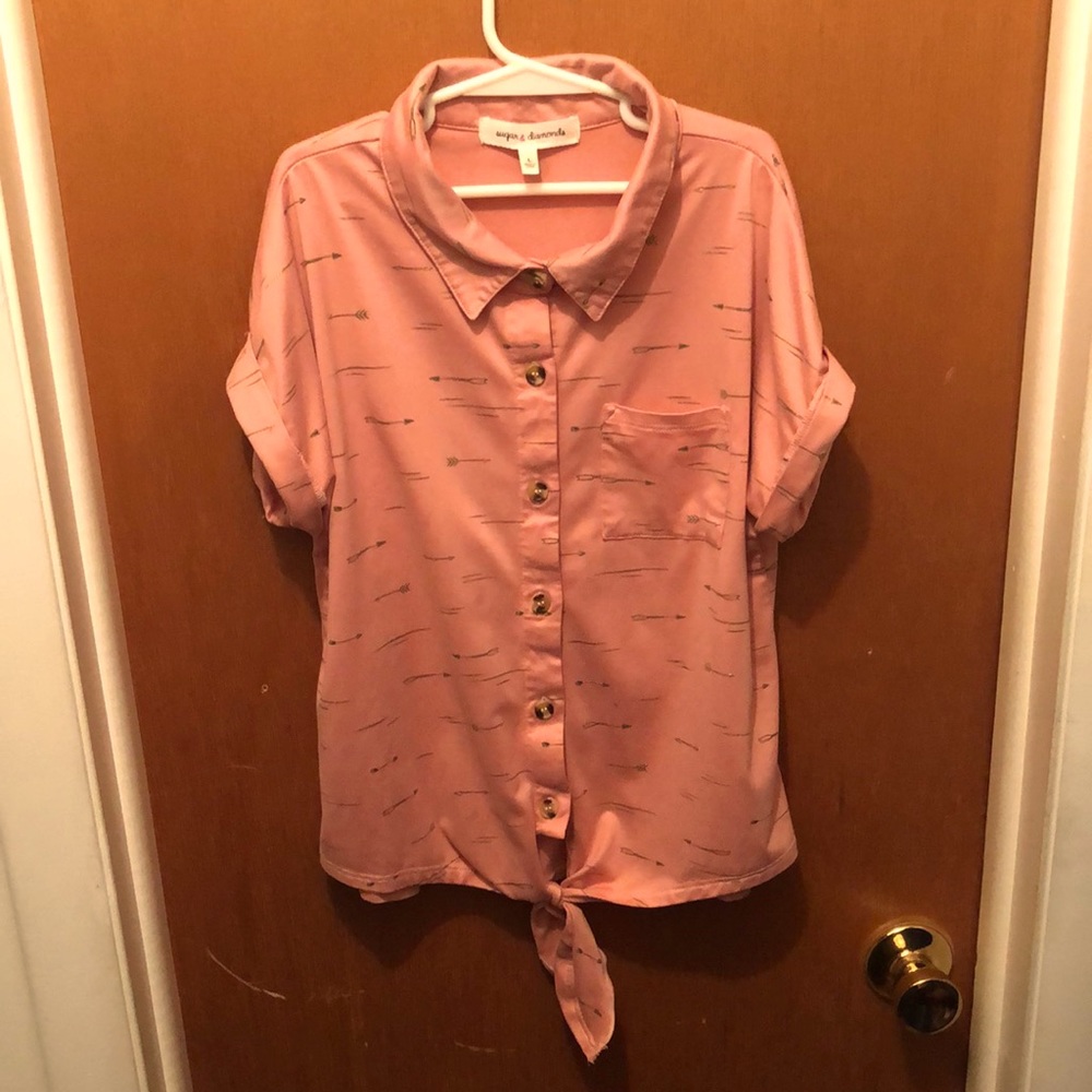 Girl’s size large cute button down shirt with a tie at the bottom.